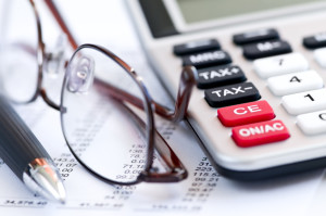 Tax calculator pen and glasses