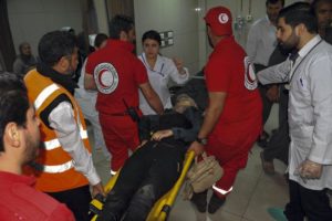 Syrians wounded receive first aid after alleged morter attack by Jaysh al-islam on Damascus