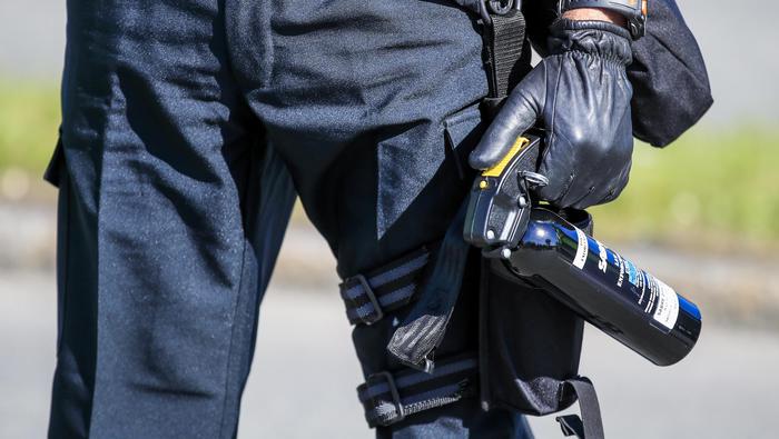 epa06793706 A police officer holds a can of pepper spray while facing protestors during the G7 Summit in Quebec City, Quebec, Canada, 08 June 2018. Leaders of the US, Canada, France, Germany, Japan, Italy, the United Kingdom as well as the European Union gather for the G7 Summit, which runs from 08 to 09 June in Charlevoix, Canada. EPA/TANNEN MAURY